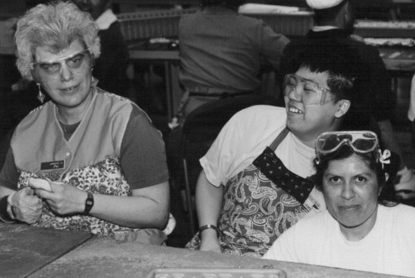 black and white photo of three clients working